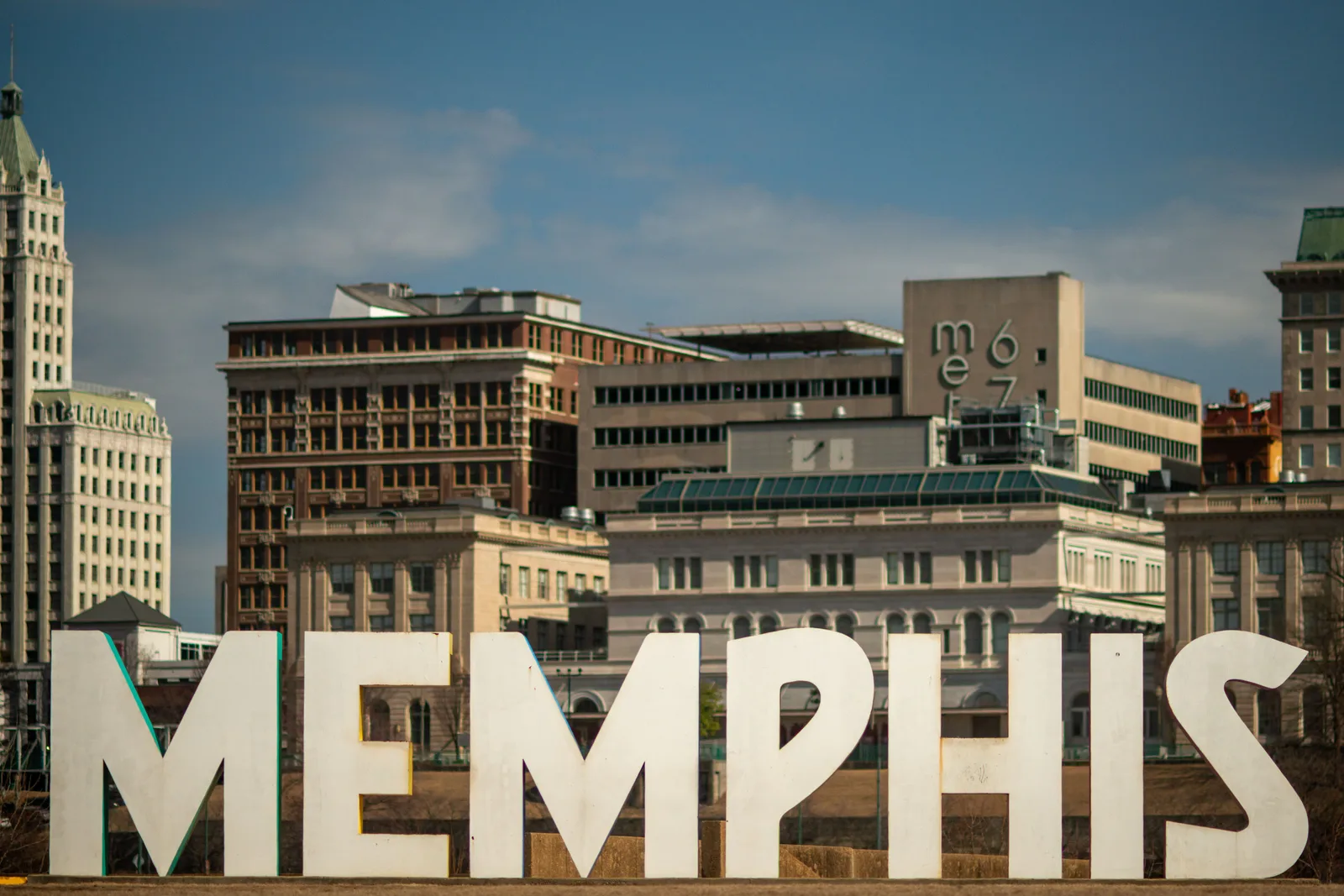 Large MEMPHIS letters in front of historic downtown buildings