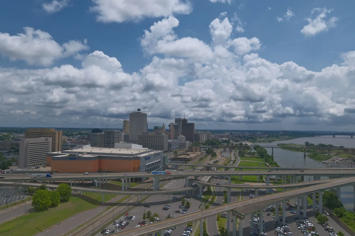 Aerial view of downtown Memphis, highways and the Mississippi River under cloudy sky